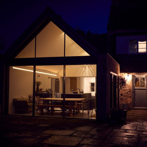 Exterior View Of Beautiful Kitchen Extension At Night