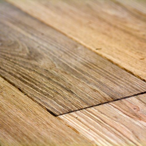 Natural light brown wooden parquet floor boards.